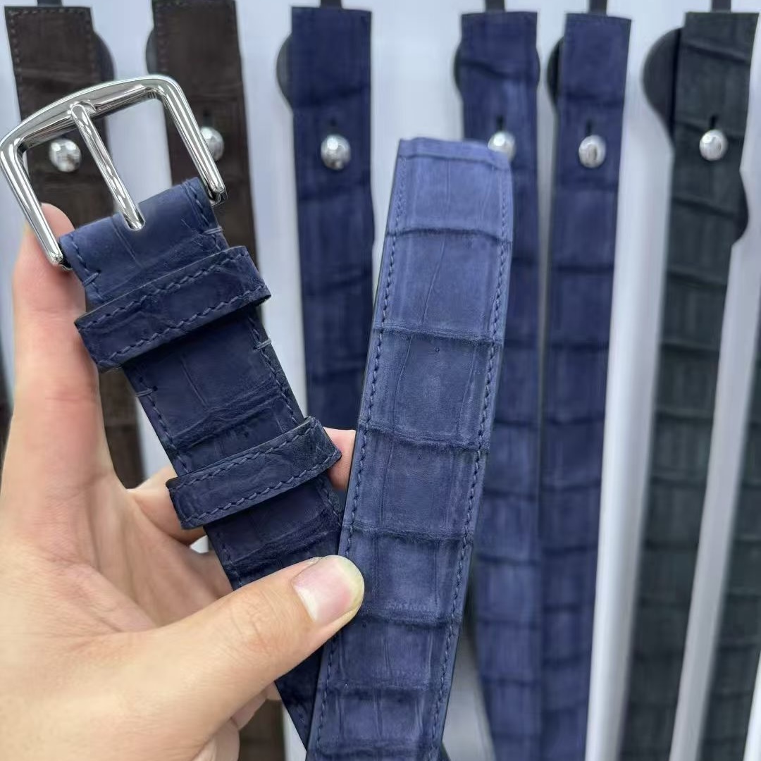 Navy blue crocodile-embossed leather belt with silver pin buckle